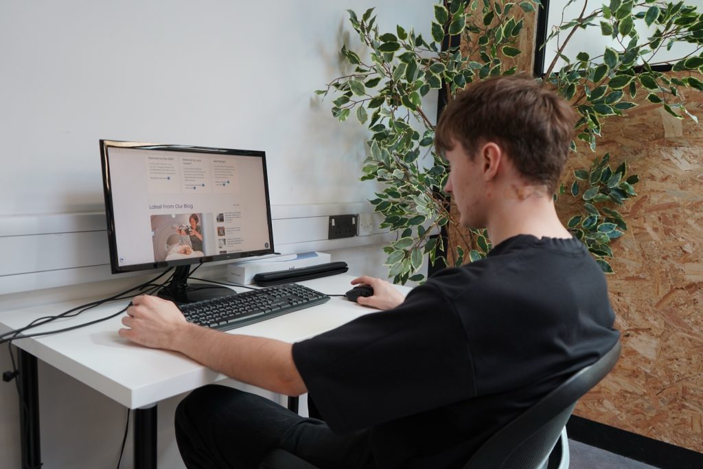 The lab dressed as an office, with a desk and monitor