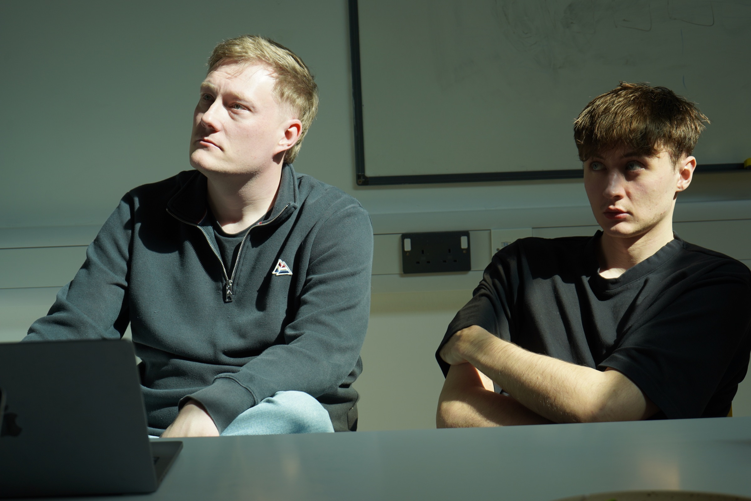 Two observers watching a session from the viewing room