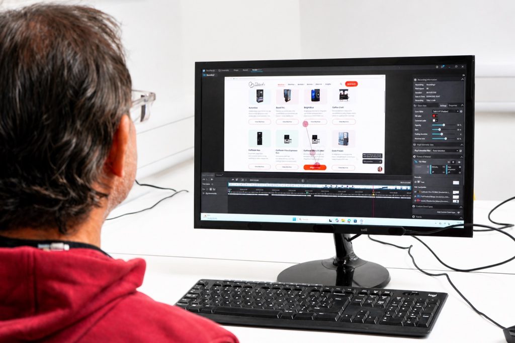 A participant at a desktop with eye tracking