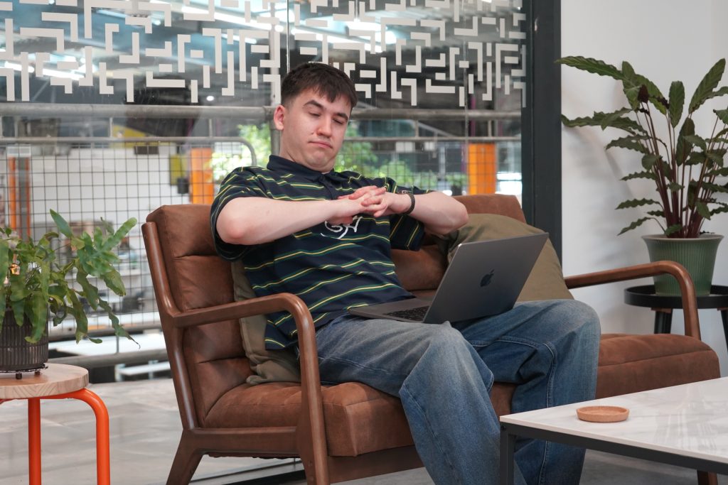 A participant pausing over a laptop