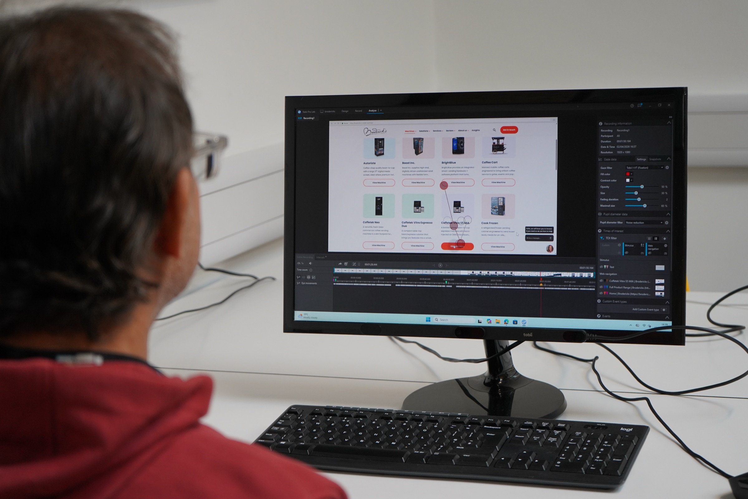 A participant at a screen with an eye tracking heatmap
